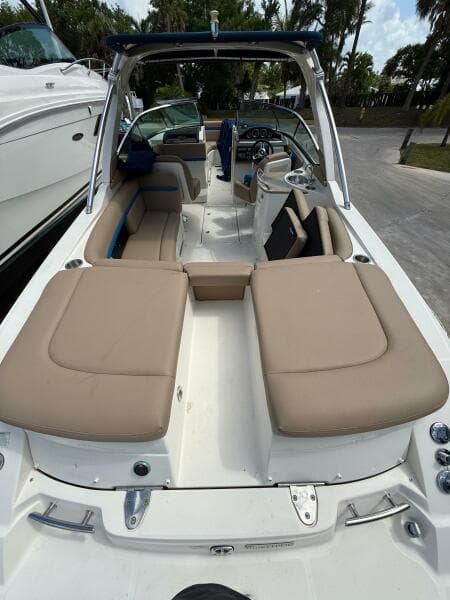 2014 Sea Ray 270 SLX boat with beige seating and sleek design.