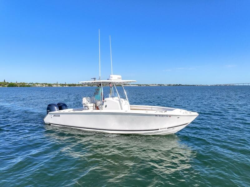 2018 Jupiter 26 FS boat on open water under clear blue sky.