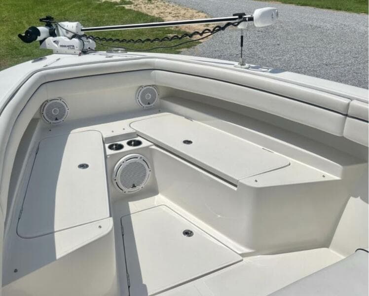 2018 Jupiter 26 FS boat interior with seating, speakers, and storage compartments.
