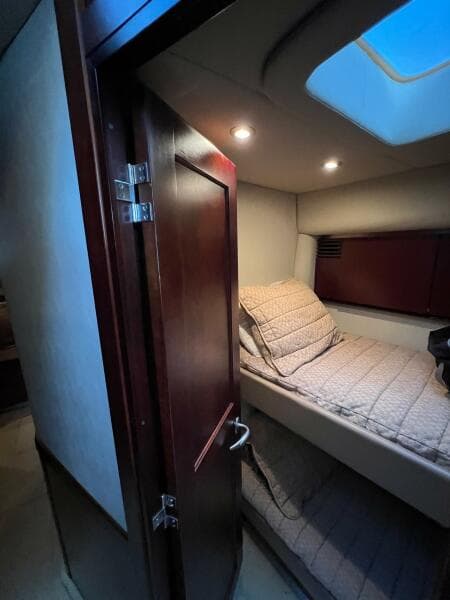 2005 Sea Ray 500 Sedan Bridge cabin interior with bed and skylight.