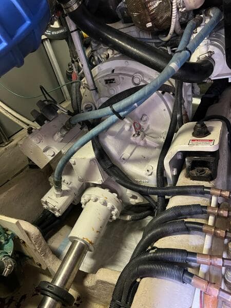 Engine room of 2005 Sea Ray 500 Sedan Bridge with visible mechanical components and wiring.