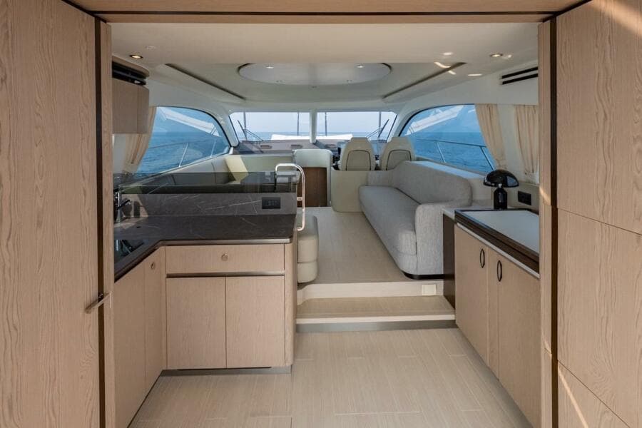 Luxurious interior of 2023 Azimut Fly 53 yacht with modern design and panoramic windows.
