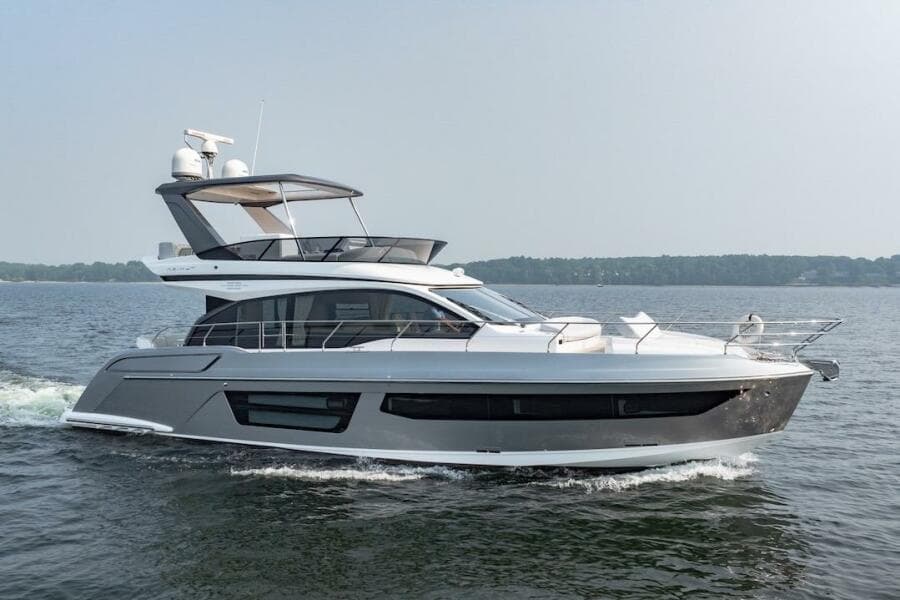 2023 Azimut Fly 53 yacht cruising on open water, side view.