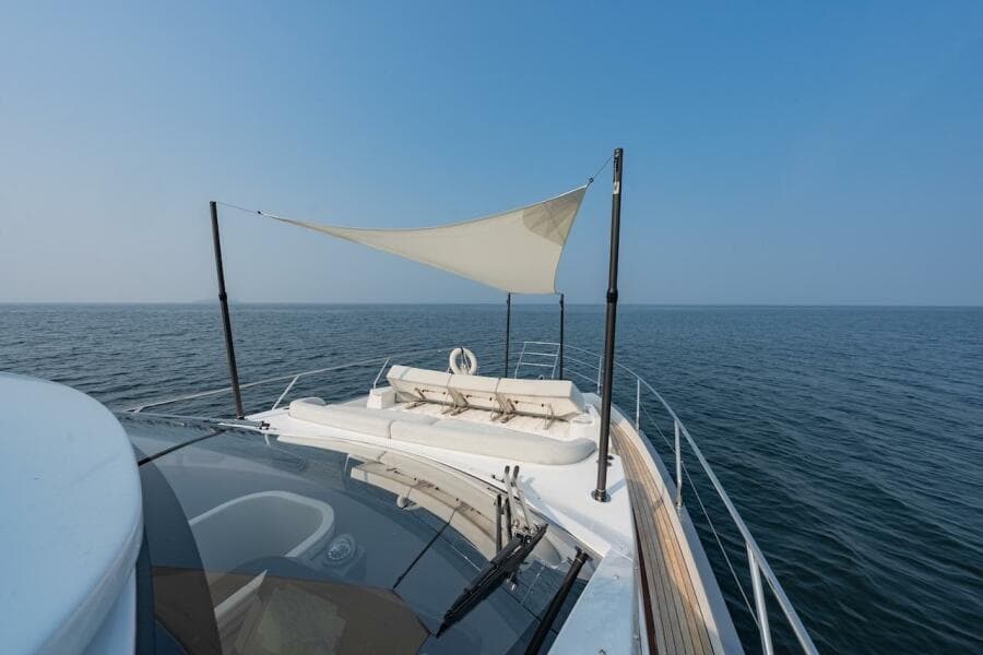 2023 Azimut Fly 53 yacht with sunshade, cruising on open sea.