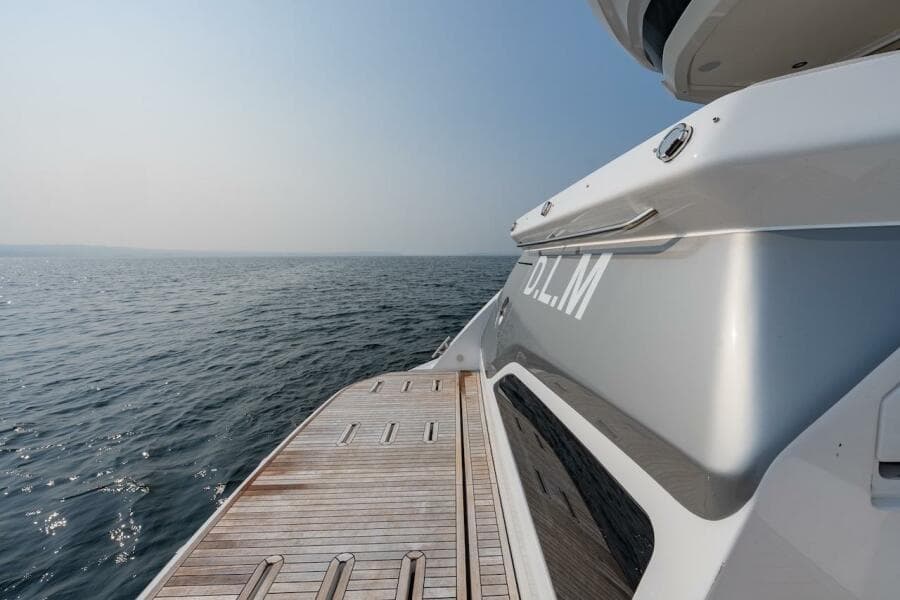 Azimut Fly 53 yacht, 2023 model, with wooden deck overlooking the ocean.