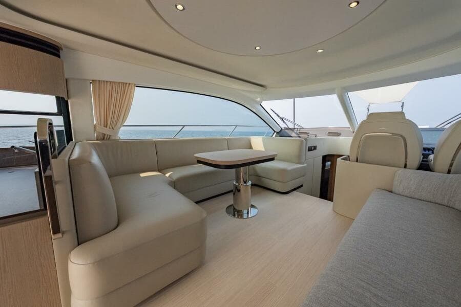 Luxurious interior of 2023 Azimut Fly 53 yacht with elegant seating and ocean view.