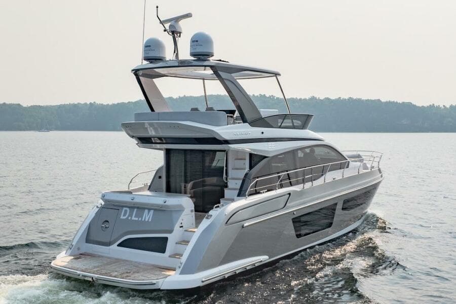 2023 Azimut Fly 53 yacht cruising on a serene lake.
