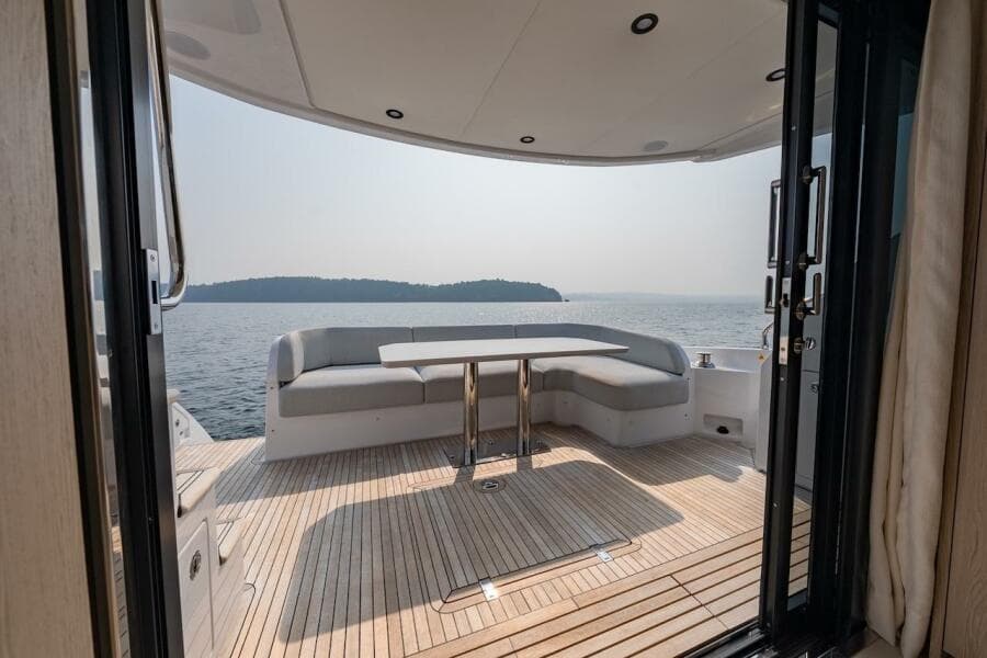 Luxurious 2023 Azimut Fly 53 yacht deck with seating, overlooking serene ocean view.