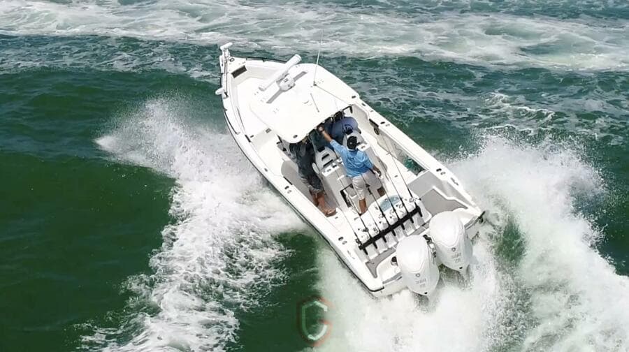 2023 CG Boat Works 35 M-Series navigating ocean waves at high speed.