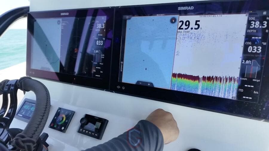 2023 CG Boat Works 35 M-Series dashboard with Simrad navigation displays.