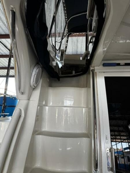 2004 Carver 360 Sport Sedan interior stairs and door under a covered area.
