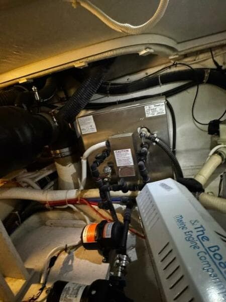 Engine room of a 2004 Carver 360 Sport Sedan with visible components and wiring.