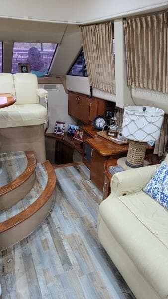 Interior of 2004 Carver 360 Sport Sedan with beige seating and wooden accents.