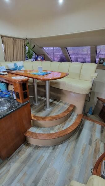 Interior of 2004 Carver 360 Sport Sedan with seating and dining area.