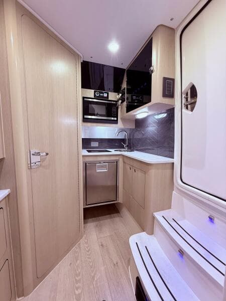 2024 Scout 400 LXF interior kitchen with modern appliances and sleek design.