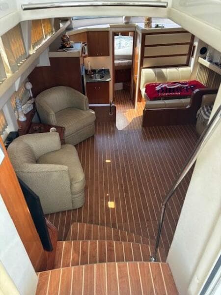 Interior of 2006 Carver 43 Motor Yacht with wood flooring and comfortable seating.