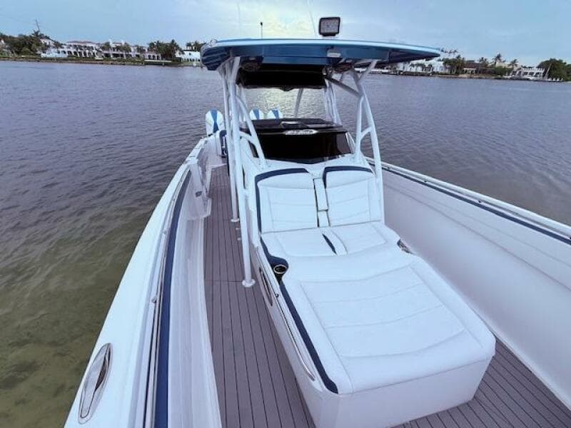 2022 Nor-Tech 390 Sport Center Console boat with sleek design on calm water.