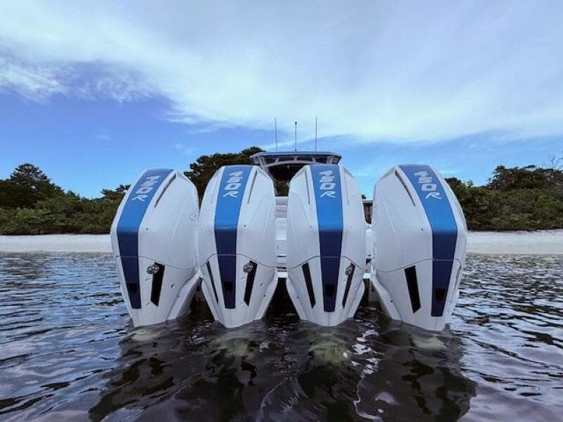 2022 Nor-Tech 390 Sport Center Console with four powerful outboard engines on water.