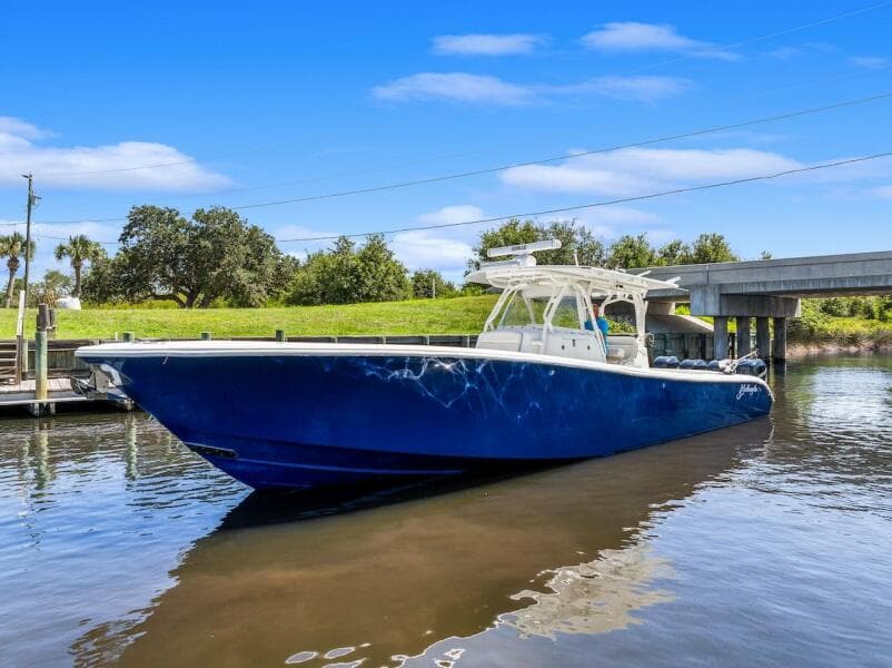 2015 Yellowfin 39 boat on calm water under blue sky.