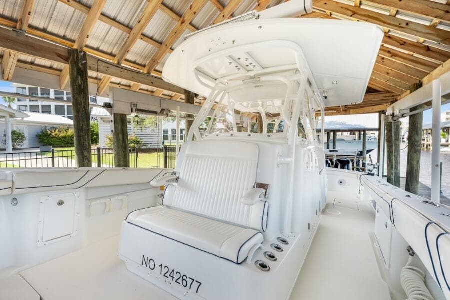2015 Yellowfin 39 boat interior under a wooden dock canopy.
