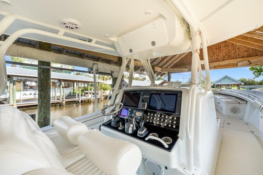 2015 Yellowfin 39 boat cockpit with advanced navigation system and luxurious white seating.