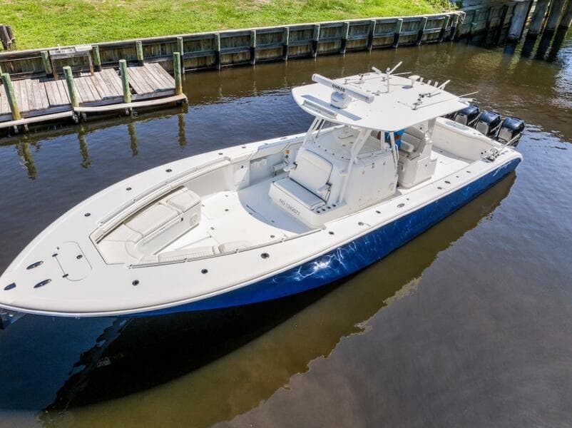 2015 Yellowfin 39 boat docked on calm water, featuring sleek design and spacious deck.