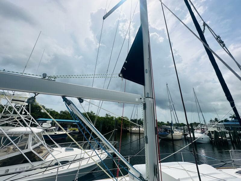 Beneteau Oceanis 45 sailboat docked at marina, cloudy sky, 2015 model.
