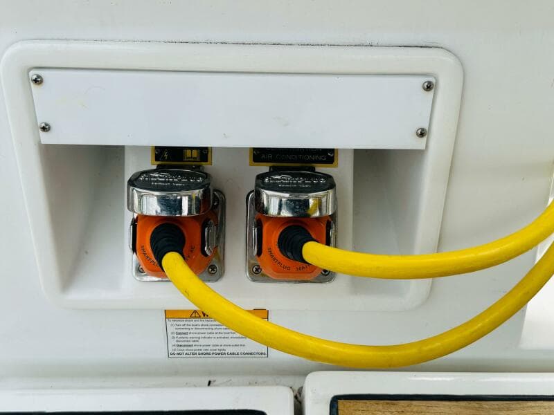Power connections on a 2015 Beneteau Oceanis 45 yacht with yellow cables.