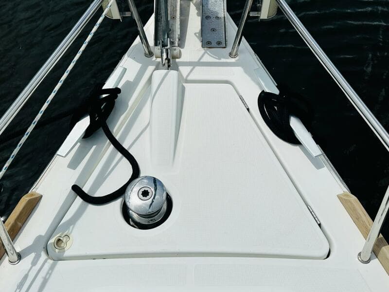 Bow of 2015 Beneteau Oceanis 45 sailboat with winch and ropes.