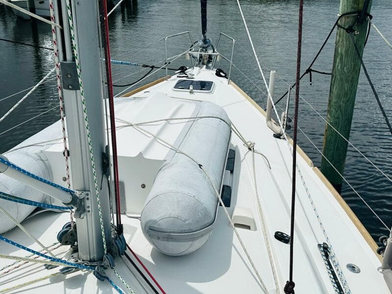 2015 Beneteau Oceanis 45 sailboat deck with dinghy and rigging.