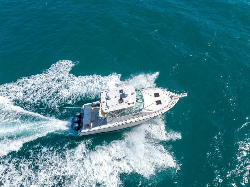 2007 Grady-White Express 360 cruising on open blue waters, aerial view.