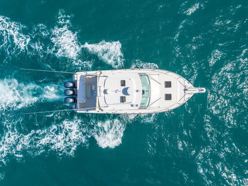 Aerial view of 2007 Grady-White Express 360 boat cruising on blue ocean waters.