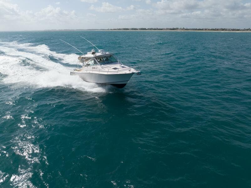 2007 Grady-White Express 360 cruising on open ocean under clear skies.