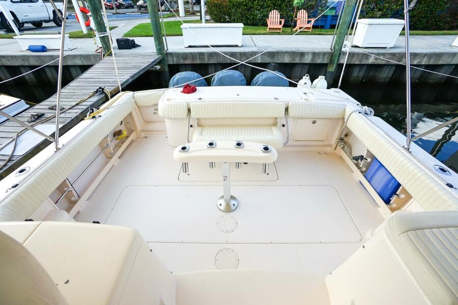 2007 Grady-White Express 360 boat interior with seating and table, docked at marina.