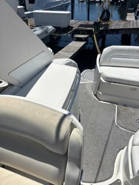 2007 Monterey 350 Sport Yacht interior with white seating and dock view.