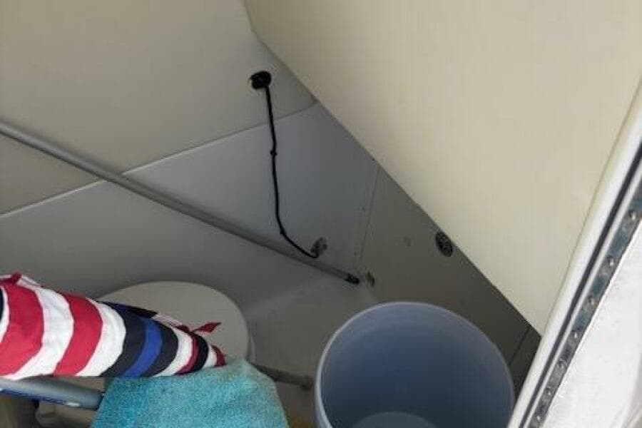 Interior of 2018 Century 2600 Center Console boat with storage and seating area.