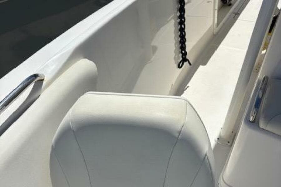 2018 Century 2600 Center Console boat interior with white seating and chain detail.