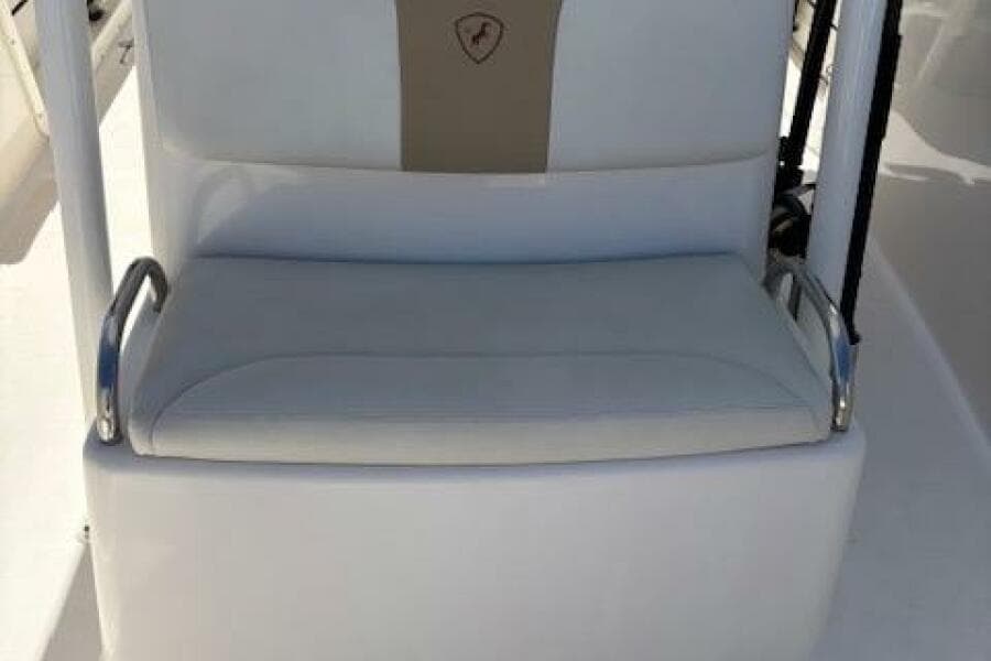 Century 2600 Center Console 2018 boat seat with white upholstery and armrests.