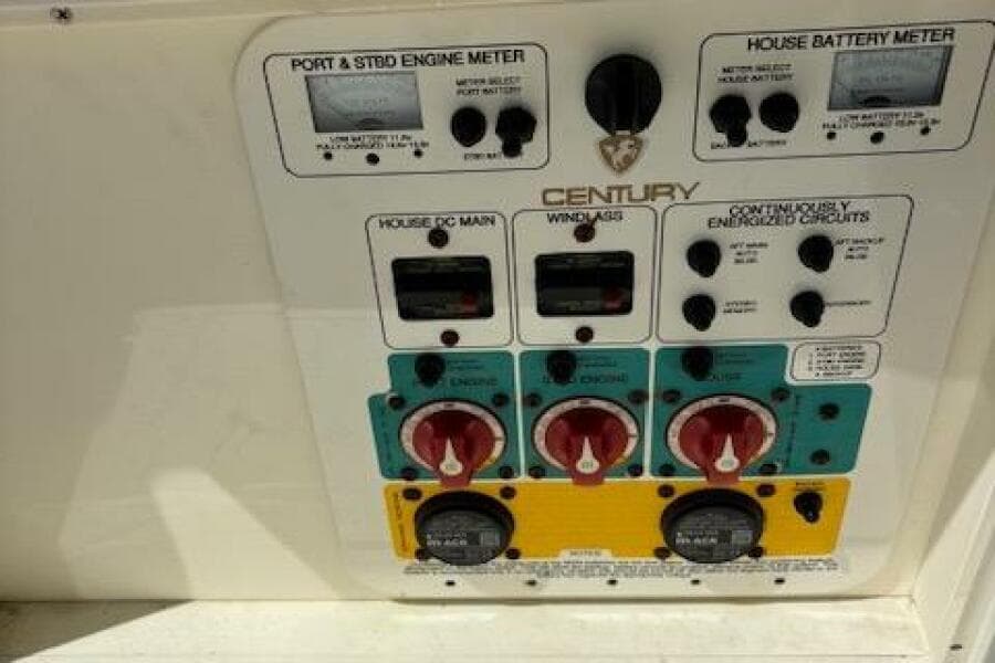 Control panel of a 2018 Century 2600 Center Console boat with various switches and meters.