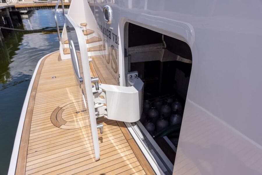 Open storage compartment on 1996 ABD 90 Explorer yacht deck, revealing scuba tanks.