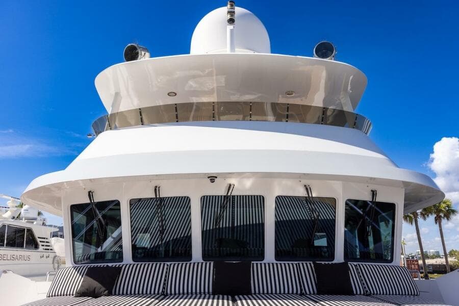 Luxury yacht ABD 90 Explorer, 1996 model, with sleek design and striped seating.