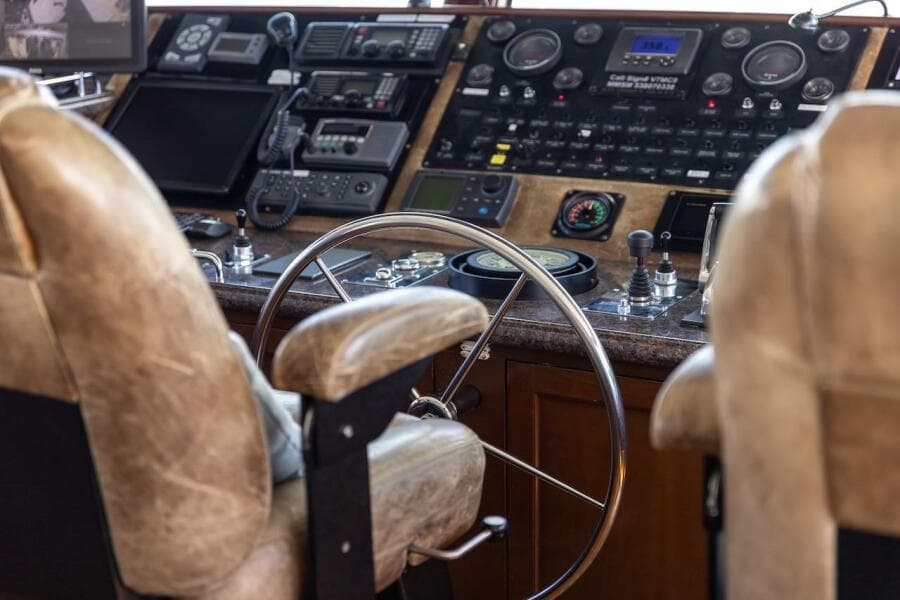 Interior of 1996 ABD 90 Explorer with nautical instruments and "Rosa" plaque.
