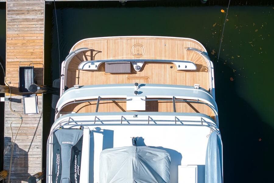 Overhead view of 1996 ABD 90 Explorer yacht docked at a wooden pier.