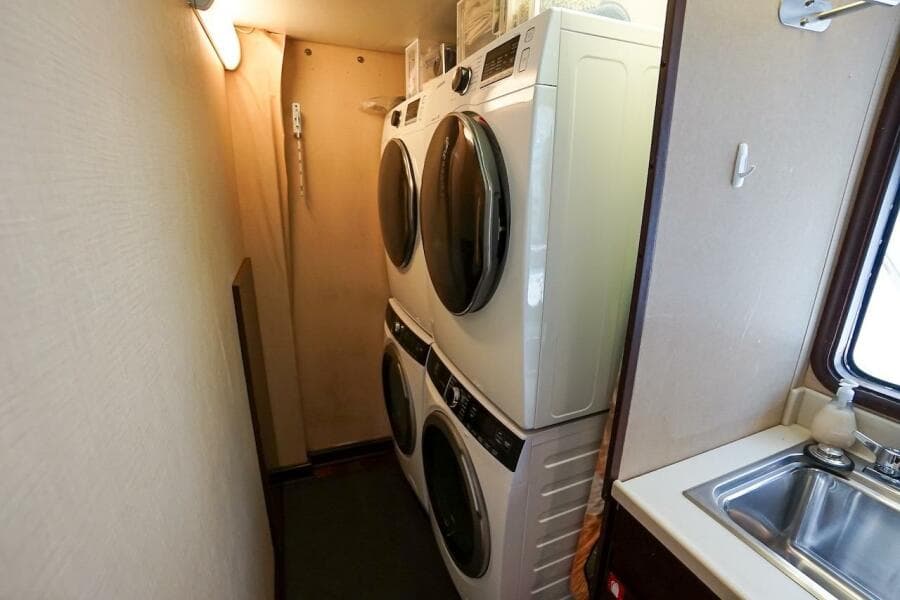 Stacked washer and dryer in 1996 ABD 90 Explorer RV interior.