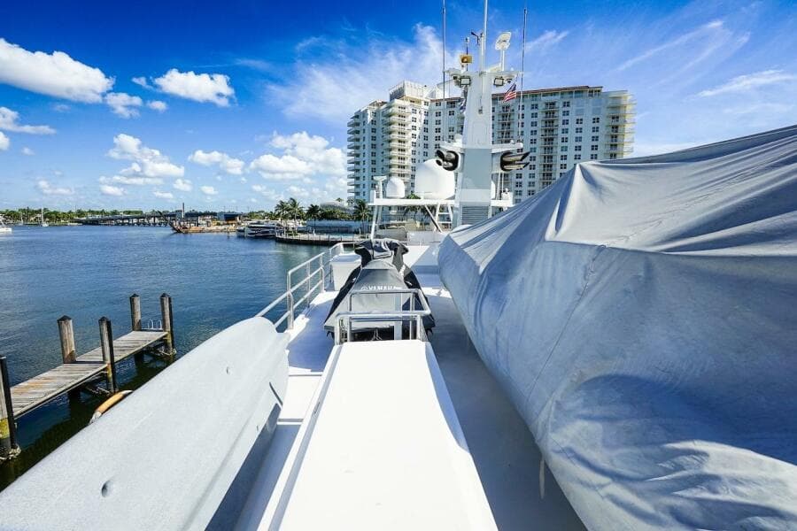 Bow of 1996 ABD 90 Explorer yacht with cityscape and waterfront view.