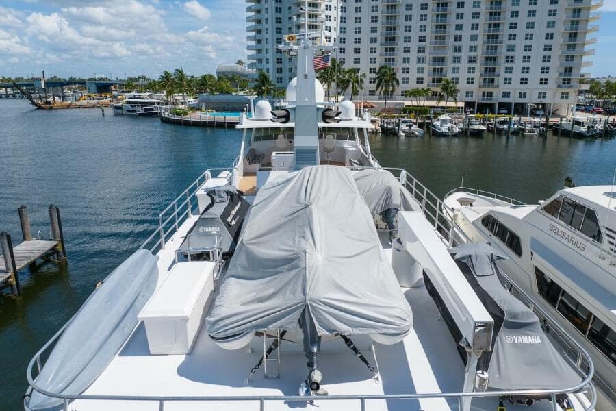 Luxury yacht ABD 90 Explorer 1996 docked at marina with covered equipment.