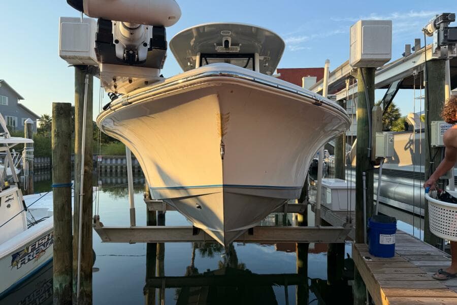 2018 Sea Hunt BX 25 FS boat docked on a lift at a marina.