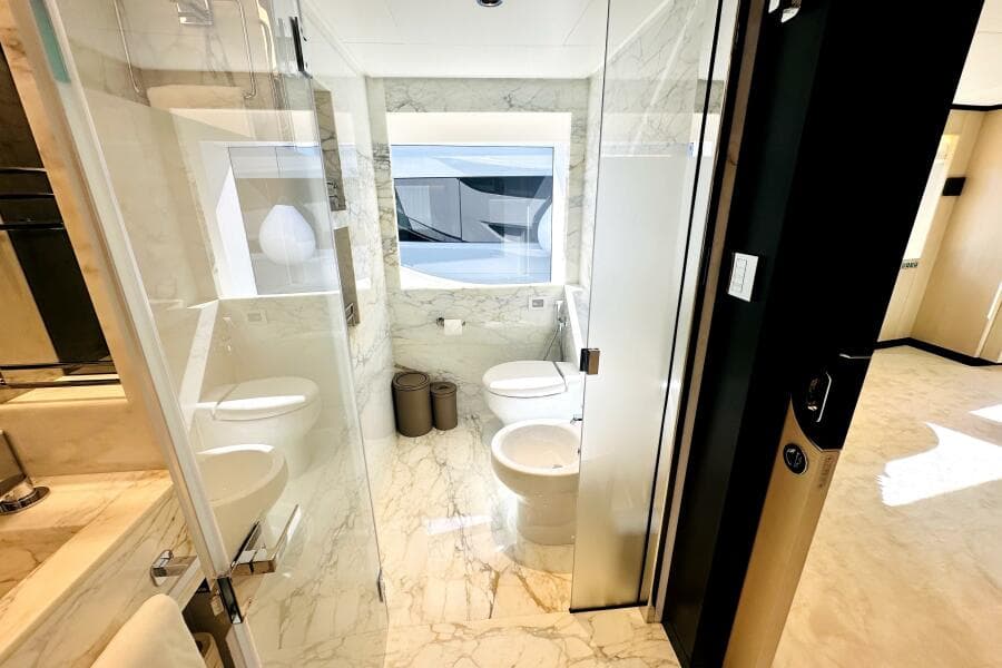 Luxurious marble bathroom interior on a 2023 Majesty 120 yacht.