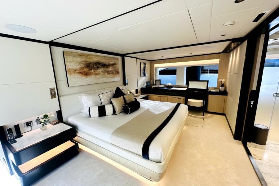 Luxurious bedroom interior of 2023 Majesty 120 yacht, featuring modern design and elegant decor.