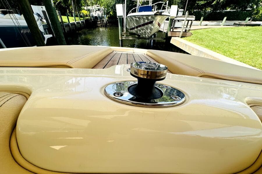 2013 Chris-Craft Corsair 22 boat interior with polished cleat and cushioned seating.